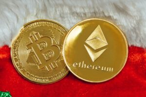 Two golden coins featuring the symbols of Bitcoin and Ethereum side by side, with Bitcoin's symbol on one coin and Ethereum's symbol on the other.